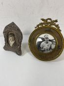 An early 20thc Birmingham silver photo frame, measures 10cm x 7cm, and a gilt metal circular frame