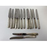 A set of twelve silver handled knives, Sheffield 1959, each measures 18cm, and two other knives (a