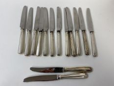 A set of twelve silver handled knives, Sheffield 1959, each measures 18cm, and two other knives (a