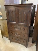 A 1920's / 30's oak Gothic revival cabinet and chest, the rectangular top over two panel doors, each