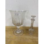 A glass goblet with flared rim and thumb cut decoration, (17cm high), and a toddy lifter (2)