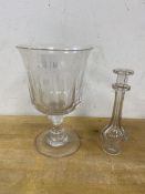 A glass goblet with flared rim and thumb cut decoration, (17cm high), and a toddy lifter (2)