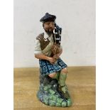 A Royal Doulton figure, The Piper, dated 1979 to base, modelled by Michael Abberley,