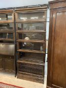 A six tier Globe Wernicke bookcase, labels attached, on base with single drawer,