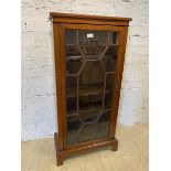 A late 19th early 20thc mahogany bookcase, the rectangular top over glazed door, before three