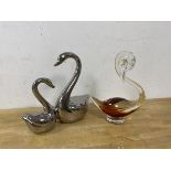 A cased glass figure of a swan, measures 20cm high, and a metal figure of two swans (2)