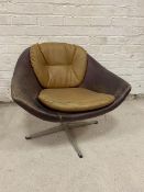 A vintage swivel lounge chair the curve seat with additional back and seat cushions on metal base