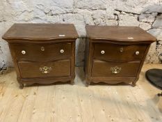 A pair of oak lamp tables with serpentine fronts over serpentine front drawer and another drawer