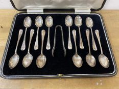 A boxed set of twelve silver coffee spoons with sugar nips, Sheffield 1930, in original box,