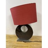 An abstract design wooden table lamp on rectangular base