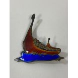 A Norwegian silver and enamel brooch in the form of a Viking long ship, measures 5.5cm x 4cm