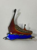 A Norwegian silver and enamel brooch in the form of a Viking long ship, measures 5.5cm x 4cm