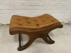 An X framed stool with studded leather seat, measures 39cm x 72cm x 44cm