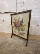A fire screen with 1930's / 40's embroidered panel, flowers in vase, measures 73cm x 56cm x 18cm