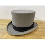 A Moss Bros grey top hat, no 7 marked on inside rim