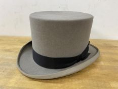 A Moss Bros grey top hat, no 7 marked on inside rim