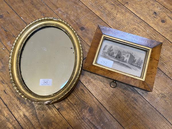 An Edwardian oval mirror with gadrooned and beaded gilt frame, some losses, (30cm x 24cm), and a