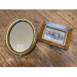 An Edwardian oval mirror with gadrooned and beaded gilt frame, some losses, (30cm x 24cm), and a