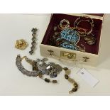 A collection of silver and costume jewellery including a chain with silver charms, a Swedish
