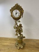 A Swiss mantel clock with a gilt metal cherub and scrolling vine design, dial with roman