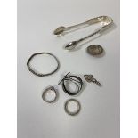 A group of silver jewellery including two rings, bracelet, pendant and brooch, also silver plated