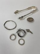 A group of silver jewellery including two rings, bracelet, pendant and brooch, also silver plated