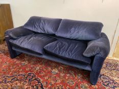 A Maralunga two seater sofa in striped blue upholstery having tears and repairs, a/f,