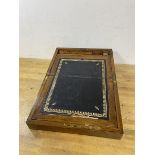 A 19thc rosewood veneered writing slope with brass plaque to top and brass bound, interior with
