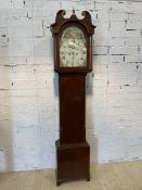 An early 19thc mahogany Grandfather clock with swan neck crest to top with urn finial, over