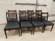 A mixed set of eight mahogany dining chairs, four Regency with tablet top rail and pierced and