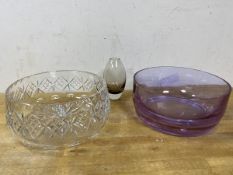 An amethyst glass bowl, measures 9cm x 20cm, a glass bowl and a smoked glass bowl of tulip form (3)