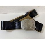 A Scottish Highland Dress belt with silver buckle engraved with Celtic design