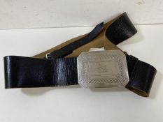 A Scottish Highland Dress belt with silver buckle engraved with Celtic design