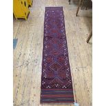 Meshwni runner with six diamonds to field within geometric border and overall motif, (275cm x 60cm)