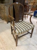 A 19thc mahogany open armchair with the arched top rail over vase shaped pierced splat, curved arms,