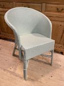 A patio chair painted egg shell blue,