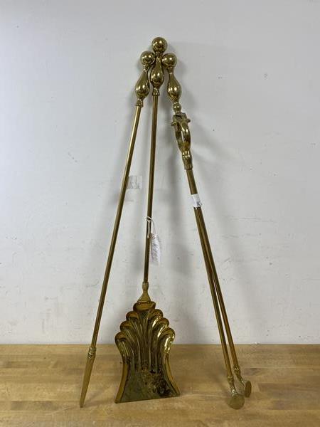 A selection of brass fire tools including tongs, shovel and poker, (71cm high)