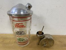 A vintage 1950's / 60's cocktail shaker with a number of recipes to side of bottle such as Martin,