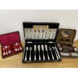 A boxed set of plated fish knives and forks