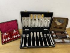 A boxed set of plated fish knives and forks