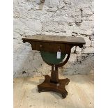 A mid 19thc mahogany sewing table, the rectangular top with curved corners, over sprawled