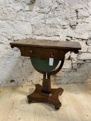 A mid 19thc mahogany sewing table, the rectangular top with curved corners, over sprawled