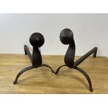 A pair of iron Arts and Crafts style andirons, (54cm x 30cm)