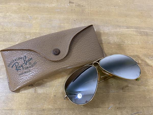 A vintage pair of Ray-Ban sunglasses, the bridge inscribed B and L 1 10 12 K G F, measure 13cm