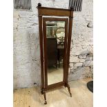 A biedermeier style mirror with top rail having sphere finial's over hinged bevelled glass, on