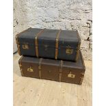 Two vintage travelling trunks, both wood and brass bound, smaller unfitted with label to interior,
