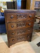 A 1920's / 30's oak Gothic revival chest of drawers, the caddy top with moulded edge over four