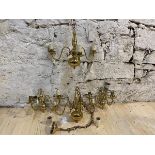 A pair of Dutch style brass three branch chandeliers with scrolled arms and faux candles, measures