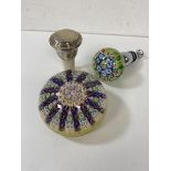 A mixed lot including a paperweight, a wine stopper with paperweight designed knopp, and cork wine