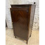 A 1920's / 30's mahogany sheet music cabinet, the rectangular top with moulded edge over blind